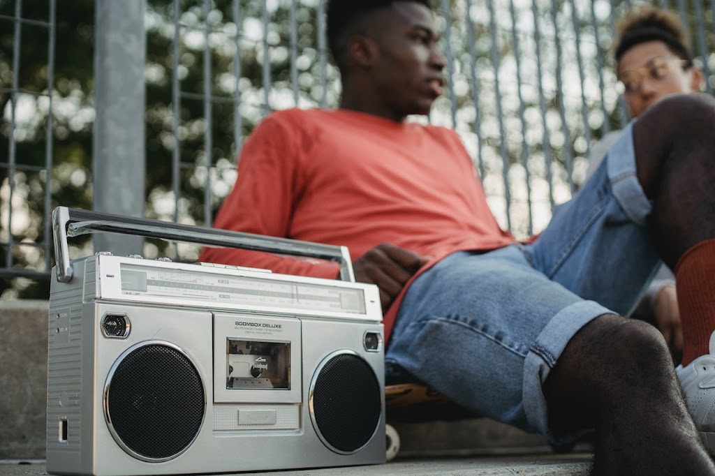Black Boy and girl with a old cassette player