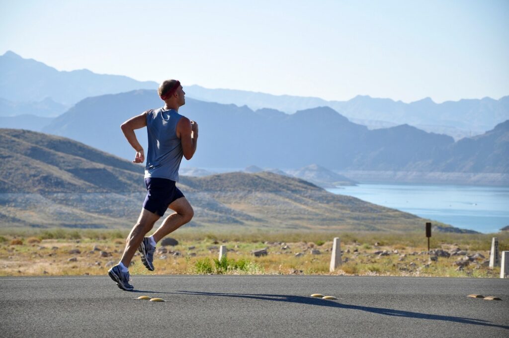 The impact of an analog lifestyle on physical health - Man Running with a mountain view